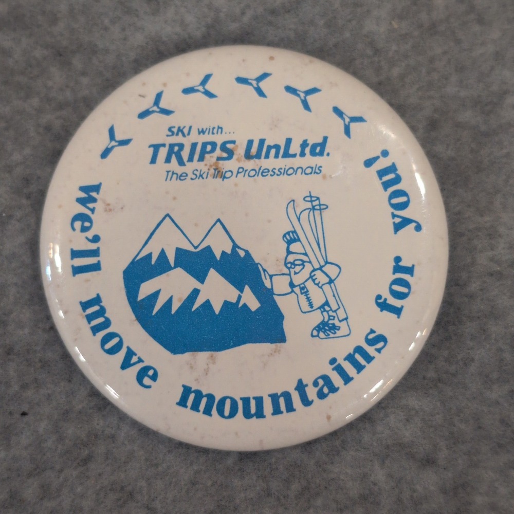 Vintage TRIPS UnLtd Ski Trip Professionals Button Pin We'll Move Mountains - Picture 1 of 3